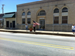 People standing outside City Hall waving American flags