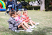 3 Young girls enjoying a concert in the park