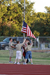 Boy Scouts raising an American flag on the flag pole