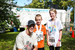 2 kids and a man after the race with their winnings